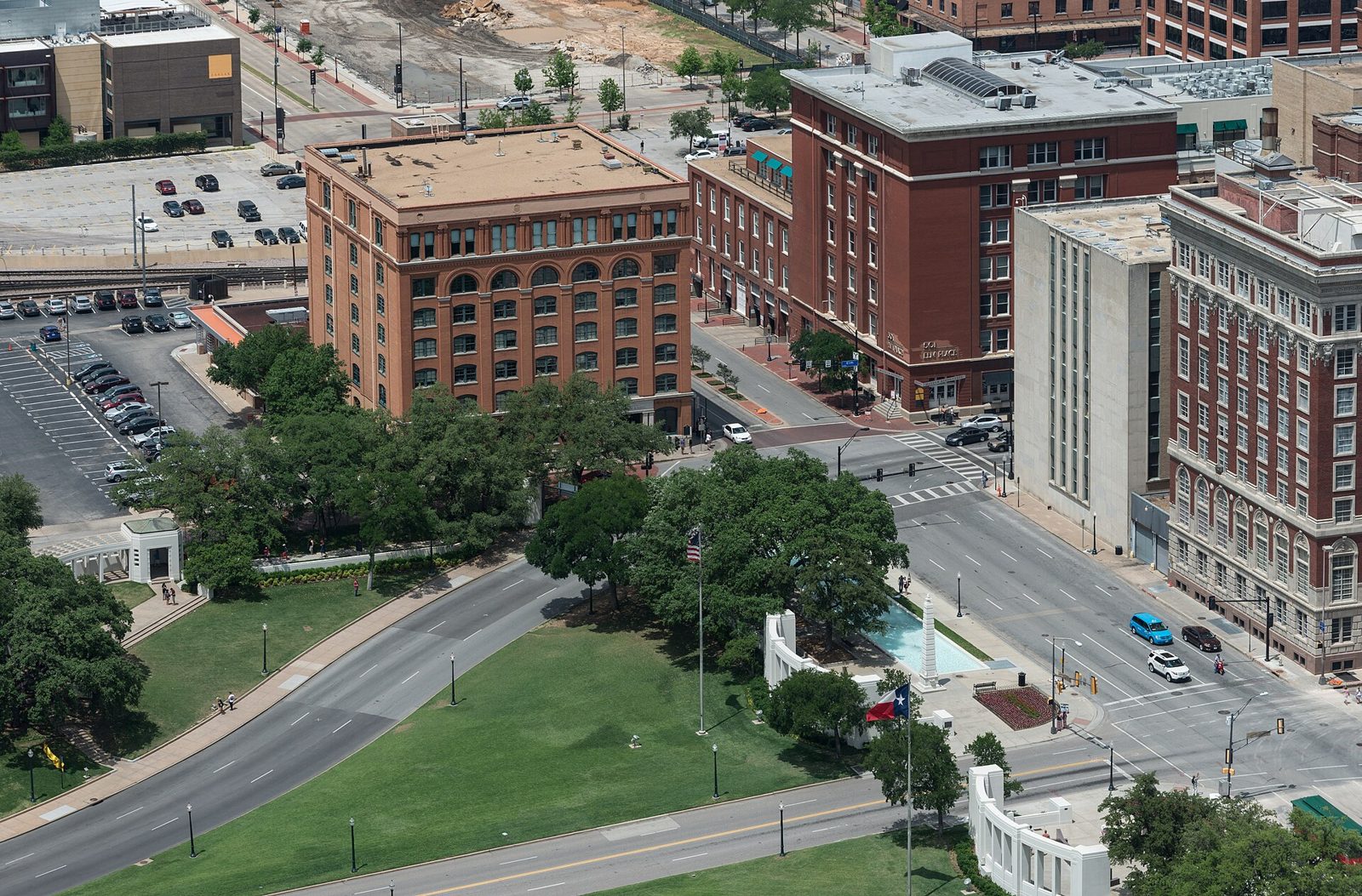 Dealey Plaza from above, with the red brick Texas School Book Depository at the corner of Houston and Elm