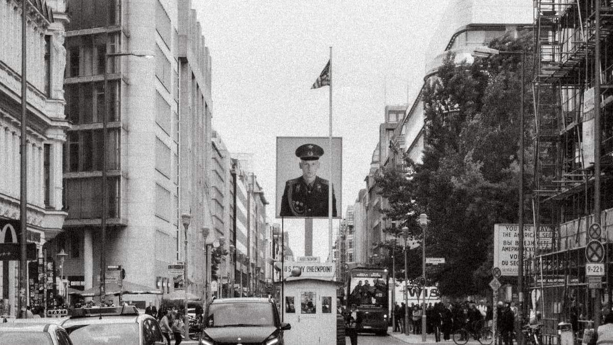 Checkpoint Charlie on Friedrichstraße, Berlin, with the replica booth and soldier portrait