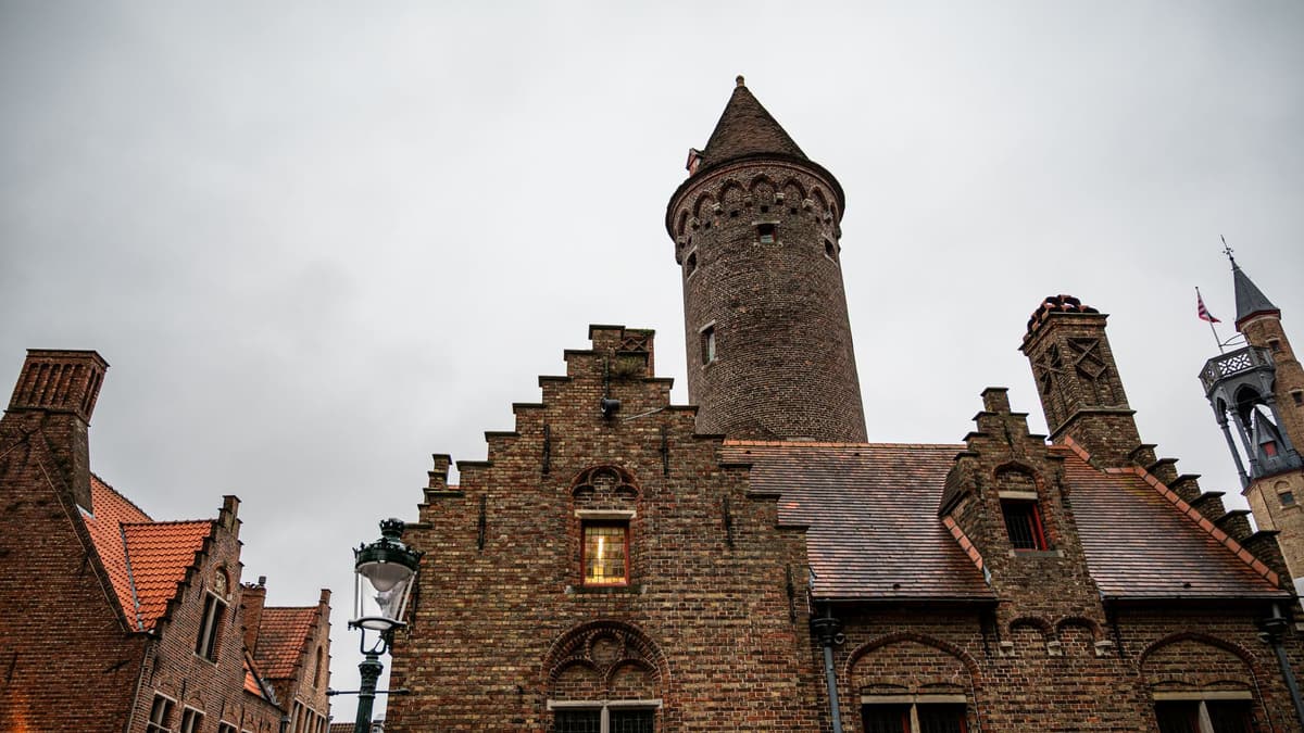 The brick tower and stepped gables of the Gruuthuse, Bruges