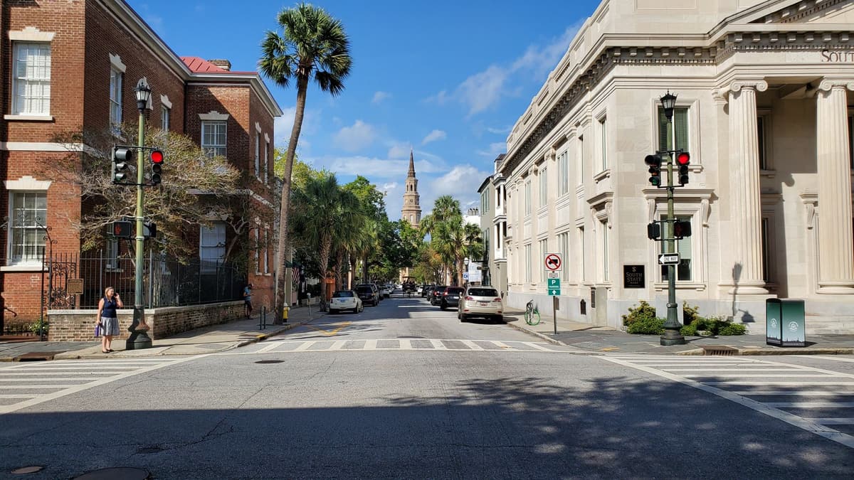 A historic Charleston street with a church spire