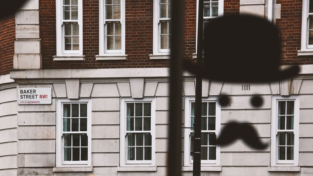 Bowler hat and moustache silhouette in a window on Baker Street, London