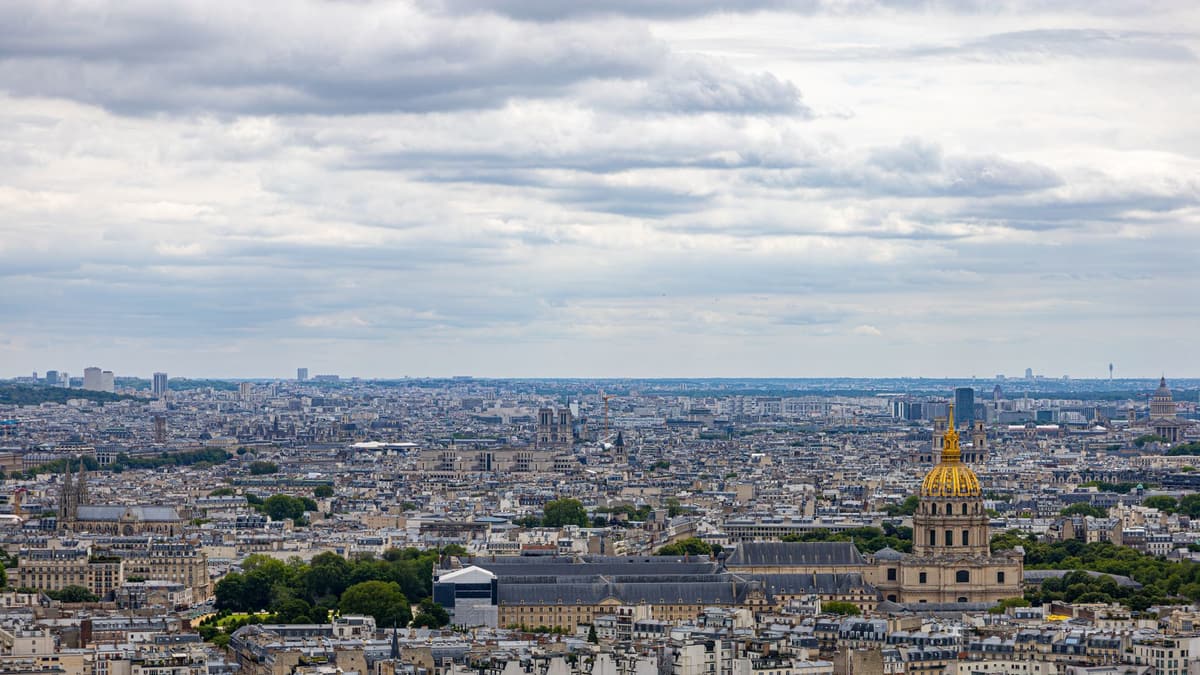 Paris rooftops with the golden dome of Les Invalides