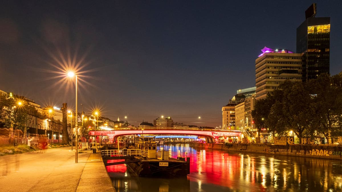 The Danube Canal lit up at night, Vienna