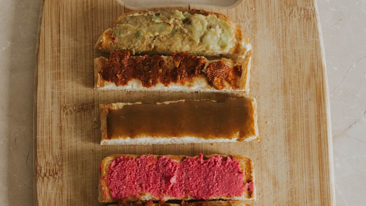 Small open sandwiches with colorful spreads