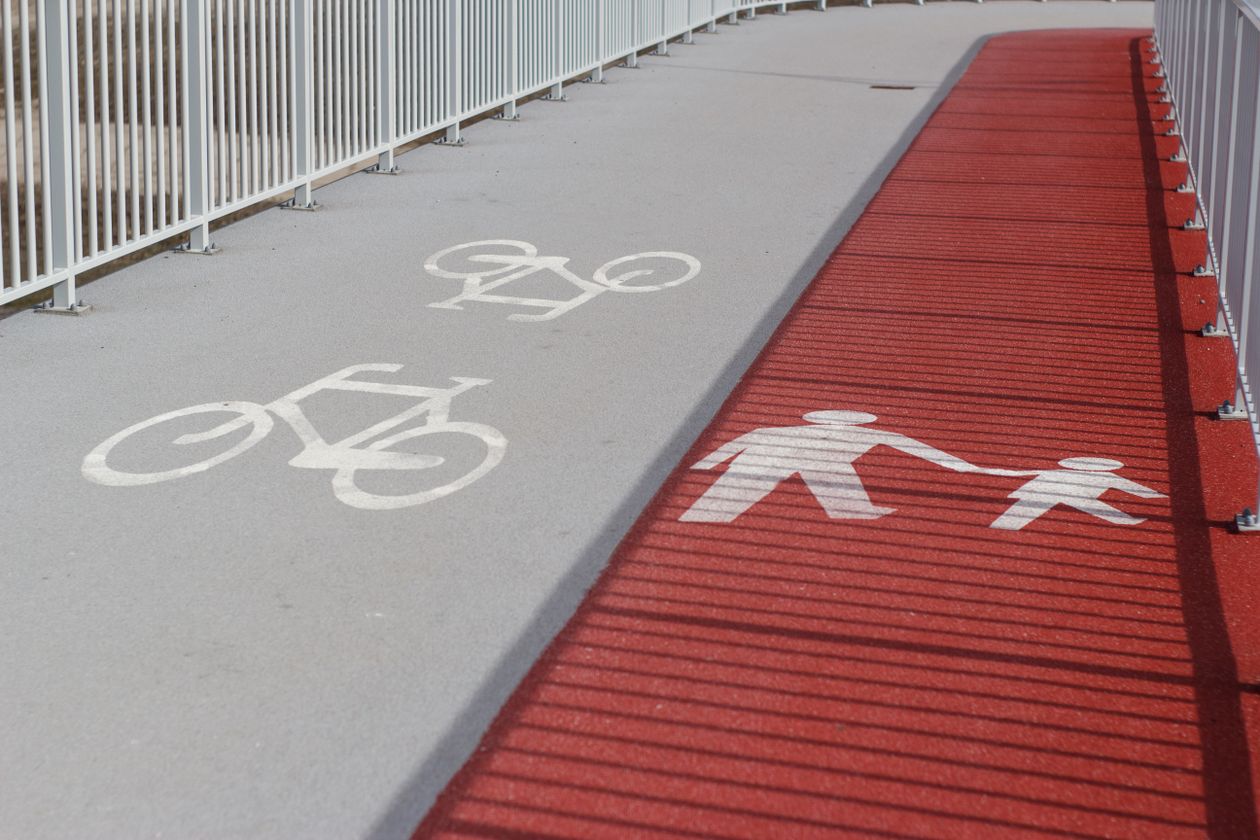 A path marked with separate lanes for bikes and for people on foot